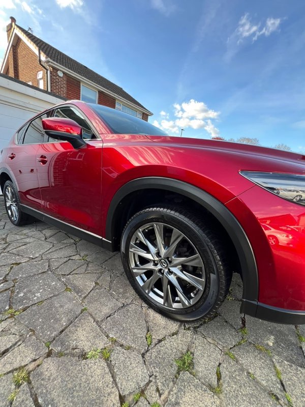 Red Mazda CX-5 valeted on a block-paved driveway
