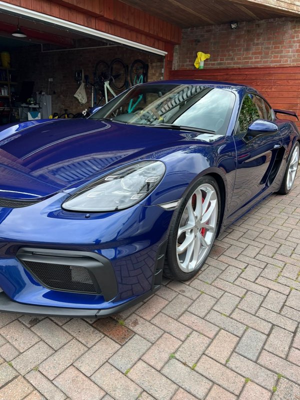Blue Porsche 718 Cayman GT4 after a machine polish